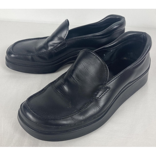 51 - A pair of black leather chunky soled shoes by Prada. Size 7, in worn condition. Complete with Prada ... 