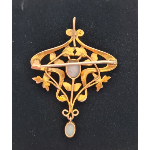 1104 - An Art Nouveau 9ct gold pendant brooch set with oval opal cabochons and seed pearls. Marked 9ct to r... 