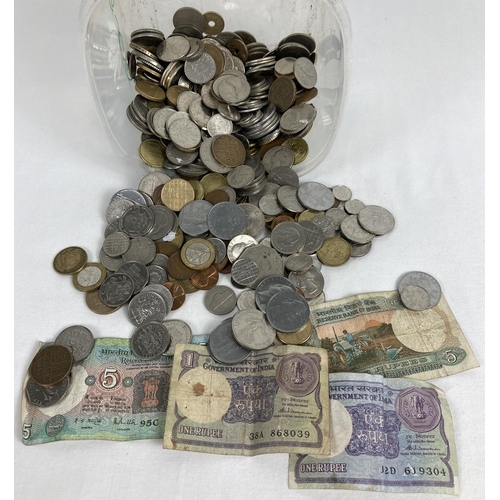 39 - A collection of vintage foreign coins and bank notes. To include examples from India, Germany, Irela... 