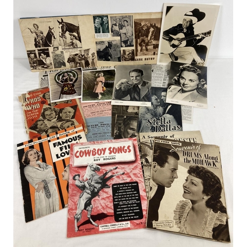 185 - A collection of vintage film related magazines, newspaper cuttings, promotional photographs and a sc... 