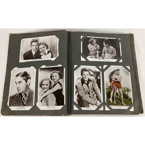 186 - A vintage postcard album containing a collection of film studio black and white and coloured photogr... 