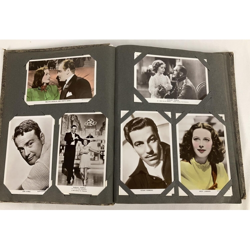 186 - A vintage postcard album containing a collection of film studio black and white and coloured photogr... 