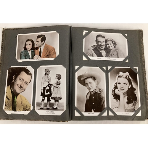 186 - A vintage postcard album containing a collection of film studio black and white and coloured photogr... 