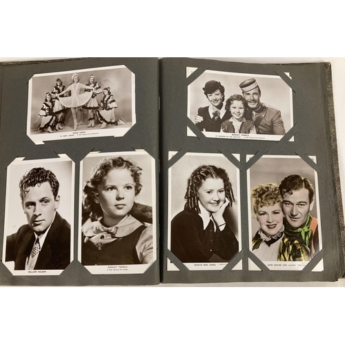 186 - A vintage postcard album containing a collection of film studio black and white and coloured photogr... 