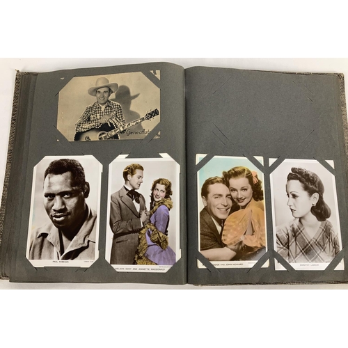 186 - A vintage postcard album containing a collection of film studio black and white and coloured photogr... 