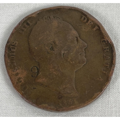 47 - An 1831 William IV penny. In worn condition with stamped numbers to both sides.