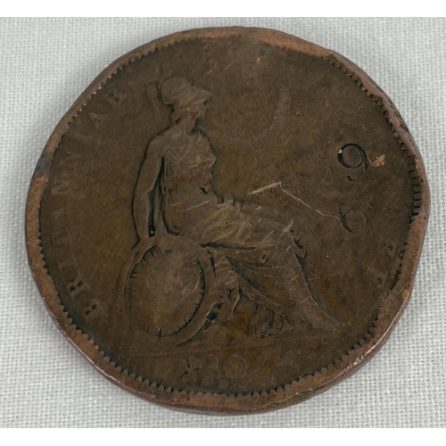 47 - An 1831 William IV penny. In worn condition with stamped numbers to both sides.