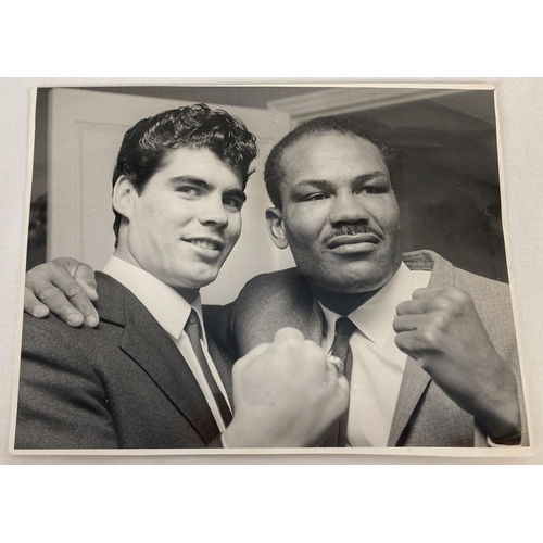 189 - A 1967 black and white photograph of boxers Joe Bygraves and Eduardo Corletti taken by Disney for th... 