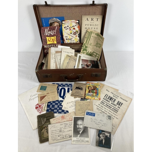 194 - A small vintage leather suitcase containing a collection of mixed vintage ephemera. To include produ... 