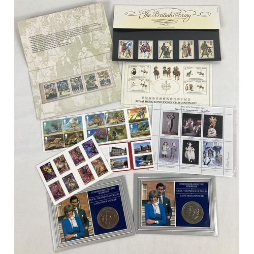 78 - A small collection of stamp sets together with 2 Royal Commemorative coins. Stamps include: Rudyard ... 