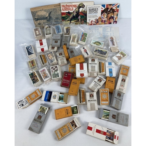 201 - A large quantity of assorted vintage tea and cigarette cards. Together with assorted cigarette packe... 