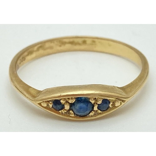 1033 - An 18ct gold and sapphire 3 stone ring with pointed oval shaped setting. Ring size N½, marked inside... 