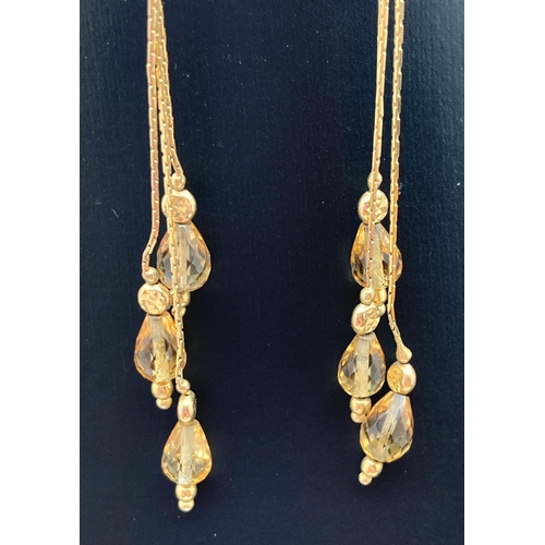 1036 - A 9ct gold and citrine drop pendant necklace and matching earrings. A 16