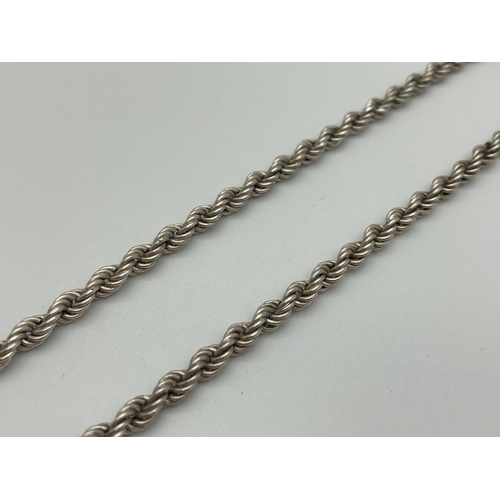 1064 - A 20 inch silver rope chain with spring clasp. Approx 12.2g total weight.