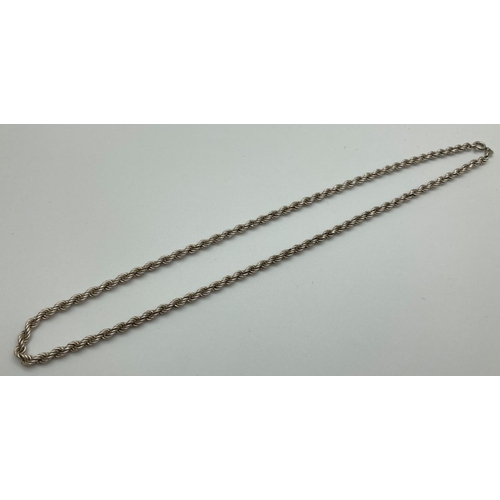 1064 - A 20 inch silver rope chain with spring clasp. Approx 12.2g total weight.