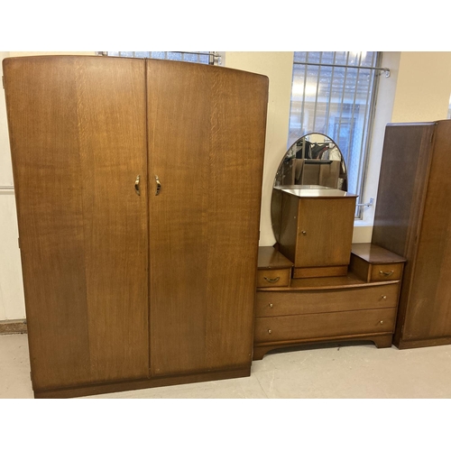 1418 - A 4 piece 1960's oak veneered bedroom suite by Austinsuite, Austin Leyton Ltd. London. Comprising. D... 