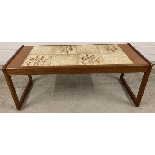 1421 - A 1970's teak tile top coffee table with wheat design, by Sunelm. Approx. 42 x 105 x 45.5cm.