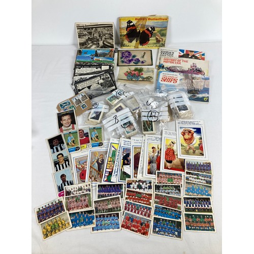 255 - A collection of assorted vintage ephemera to include postcards, chewing gum cards and Brooke Bond te... 