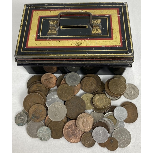 1218 - A small vintage metal cash tin with carry handle, containing a collection of vintage British and for... 