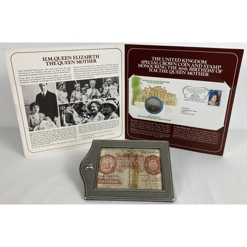 1219 - A vintage 10 shilling note in a silver plated frame. Together with a presentation folder containing ... 