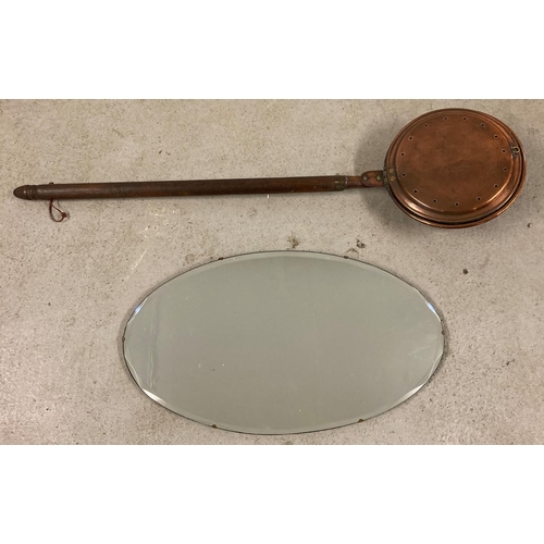 1346 - A vintage copper warming pan with dark wood handle, together with an oval shaped bevel edged hall mi... 