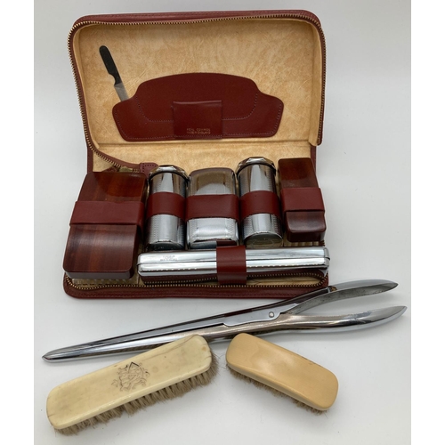 1349 - A vintage leather cased chrome and wood men's vanity set with zip fastening. Together with 2 small b... 