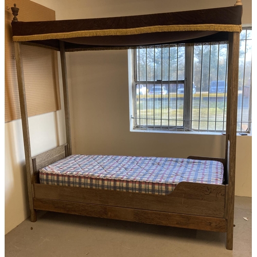 1435 - A vintage solid oak single four poster bed with flat head and base board, canopy and carved finials.... 