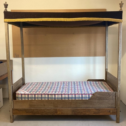 1435 - A vintage solid oak single four poster bed with flat head and base board, canopy and carved finials.... 