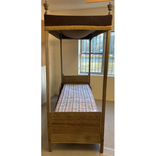 1435 - A vintage solid oak single four poster bed with flat head and base board, canopy and carved finials.... 