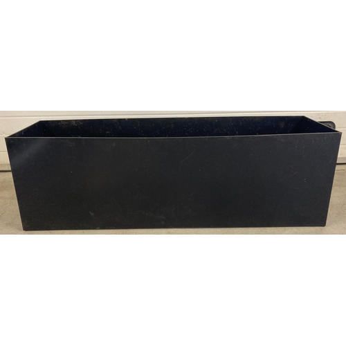 1402 - A large black plastic garden planter, approx. 46cm tall x 140cm x 38cm.