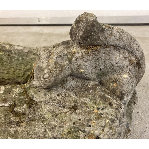 1409 - A long shallow concrete planter made to look like a log with a squirrel sitting on the edge, approx.... 