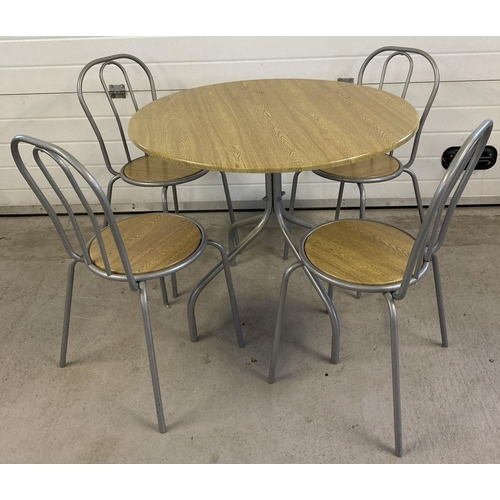 1444 - A modern circular wood effect and silver painted metal dining table with 4 matching chairs. Table ap... 