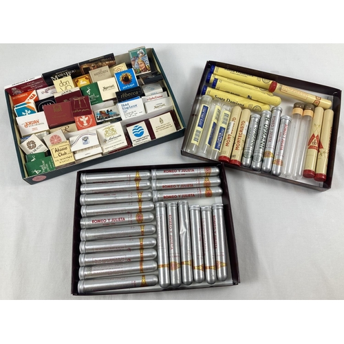 1352 - A collection of assorted cigar tubes and match books. To include examples from Joya Del Rey, Montecr... 