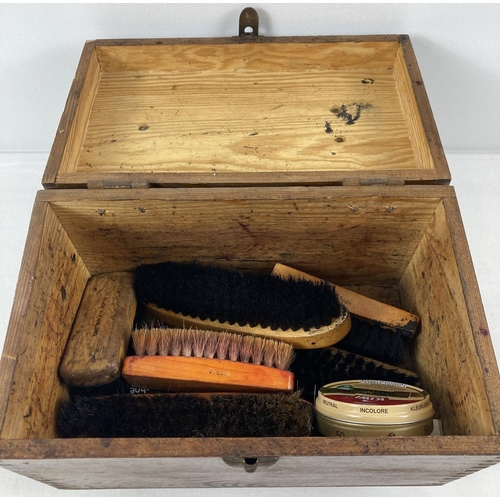 1356 - A vintage wooden shoe shine box complete with brushes and tins of polish.