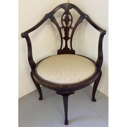 1446 - A late Victorian mahogany oval seated corner arm chair with carved & inlaid detail. Cream upholstere... 