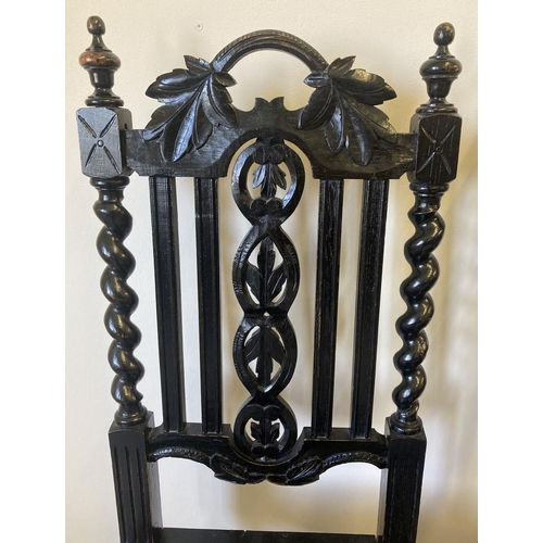 1447 - A pair of Victorian carved dark oak barley twist hall chairs. With foliate carved detail to backs, t... 