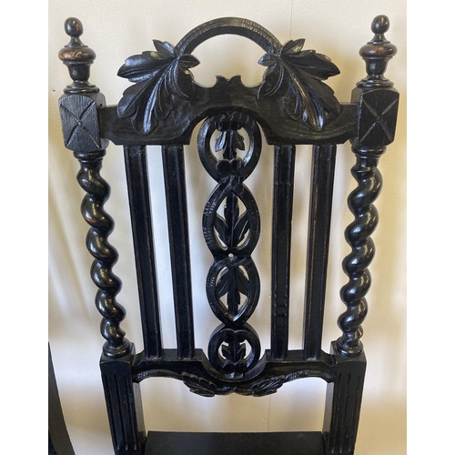 1447 - A pair of Victorian carved dark oak barley twist hall chairs. With foliate carved detail to backs, t... 