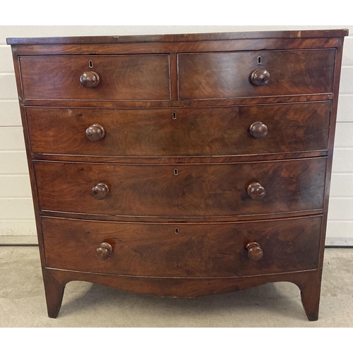 1449 - A Victorian mahogany bow fronted 2 over 3 chest of drawers with knob handles. Brass escutcheons to e... 