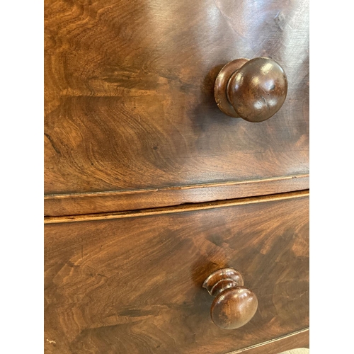 1449 - A Victorian mahogany bow fronted 2 over 3 chest of drawers with knob handles. Brass escutcheons to e... 