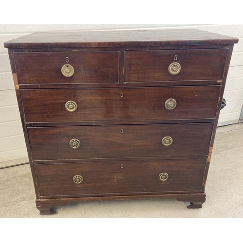 1450 - A Victorian mahogany 2 over 3 chest of drawers with brass drop down handles. Brass escutcheons to ea... 