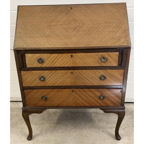 1452 - A vintage 3 drawer bureau with brass hooped handles and escutcheons. Drop down writing platform with... 