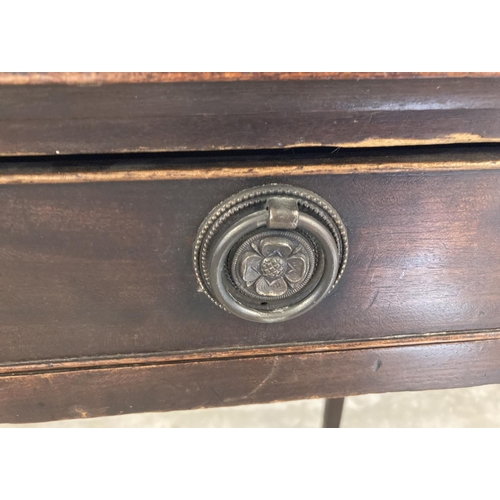 1453 - A vintage dark oak 2 drawer hall/console table with brass hooped handles and straight legs. Approx. ... 