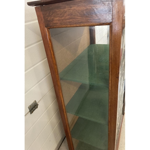 1460 - A Victorian mahogany display cabinet with leaded stained glass door& inlaid detail. 3 interior baize... 