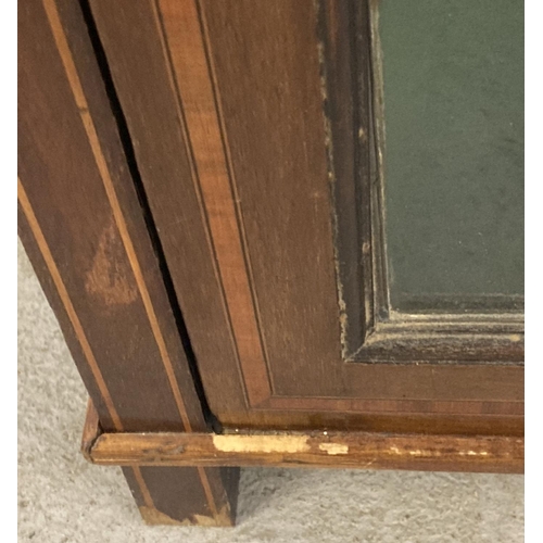 1460 - A Victorian mahogany display cabinet with leaded stained glass door& inlaid detail. 3 interior baize... 