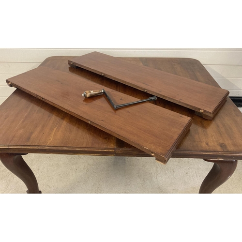 1461 - A Victorian mahogany wind out dining table with large ball and claw feet. Complete with 2 additional... 