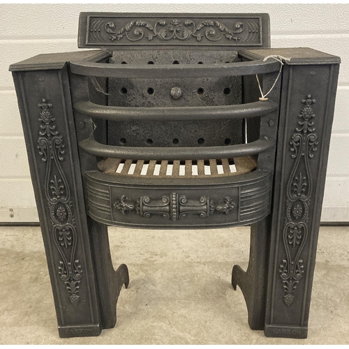 1240 - A Victorian cast iron fire grate with curve fronted basket and decorative scroll & foliate detail. A... 