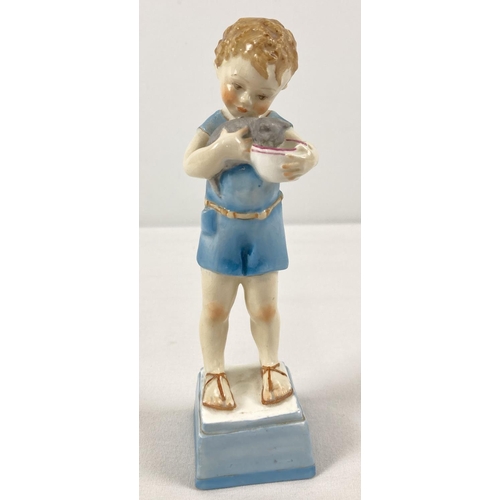 1291 - A late 1930's Royal Worcester porcelain figurine of a small boy with his kitten. Model No. 3261 enti... 