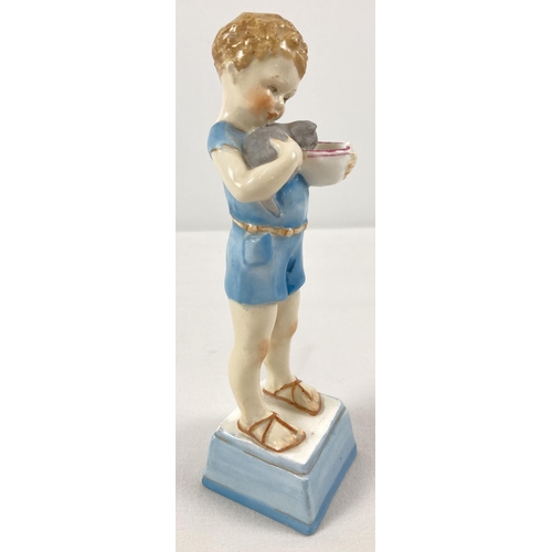 1291 - A late 1930's Royal Worcester porcelain figurine of a small boy with his kitten. Model No. 3261 enti... 