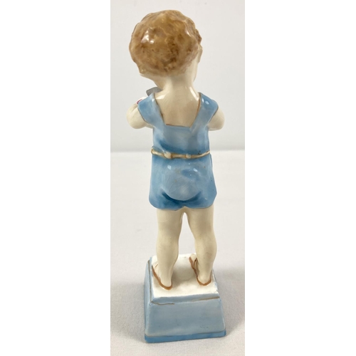 1291 - A late 1930's Royal Worcester porcelain figurine of a small boy with his kitten. Model No. 3261 enti... 