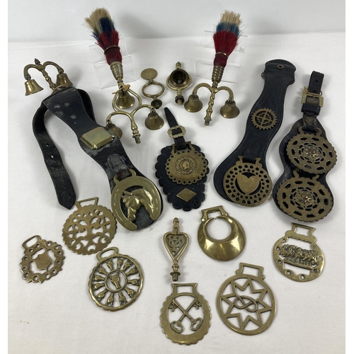 1243 - A collection of vintage brass heavy horse accessories, to include terrets, plumes, bells and brasses... 